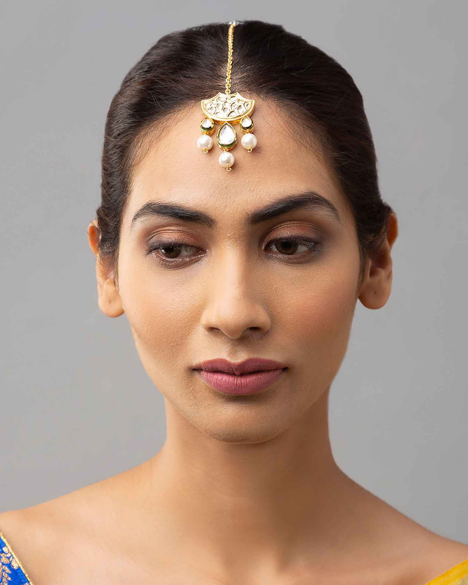 Gold Maang Tikka in Hydro Kundan Polki paired with Luxe Shell Pearls 